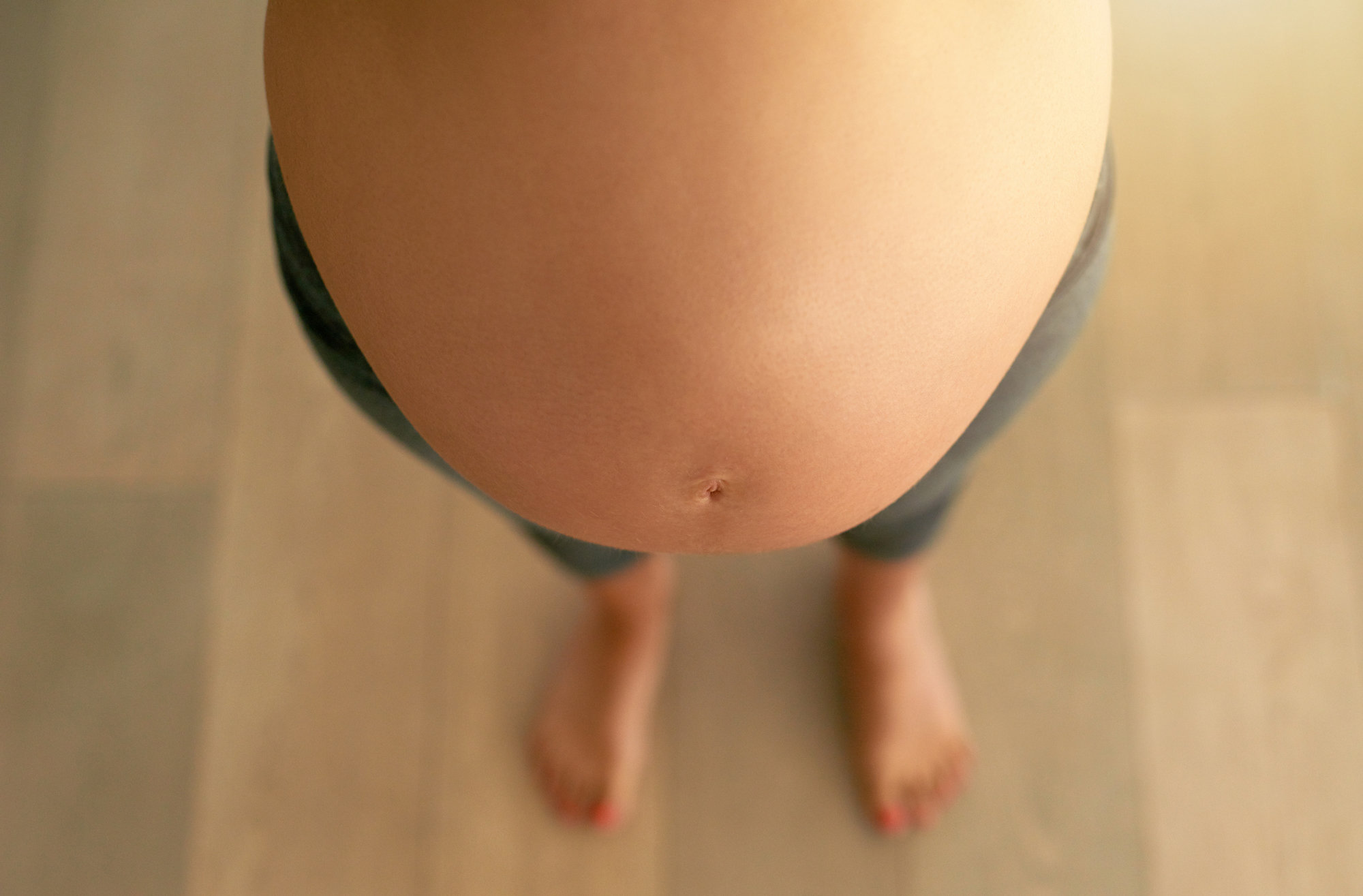 bare pregnant belly woman