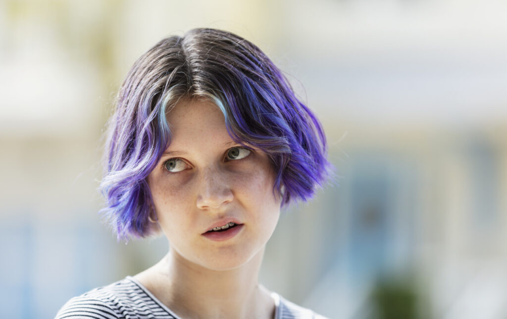 teen rolling eyes