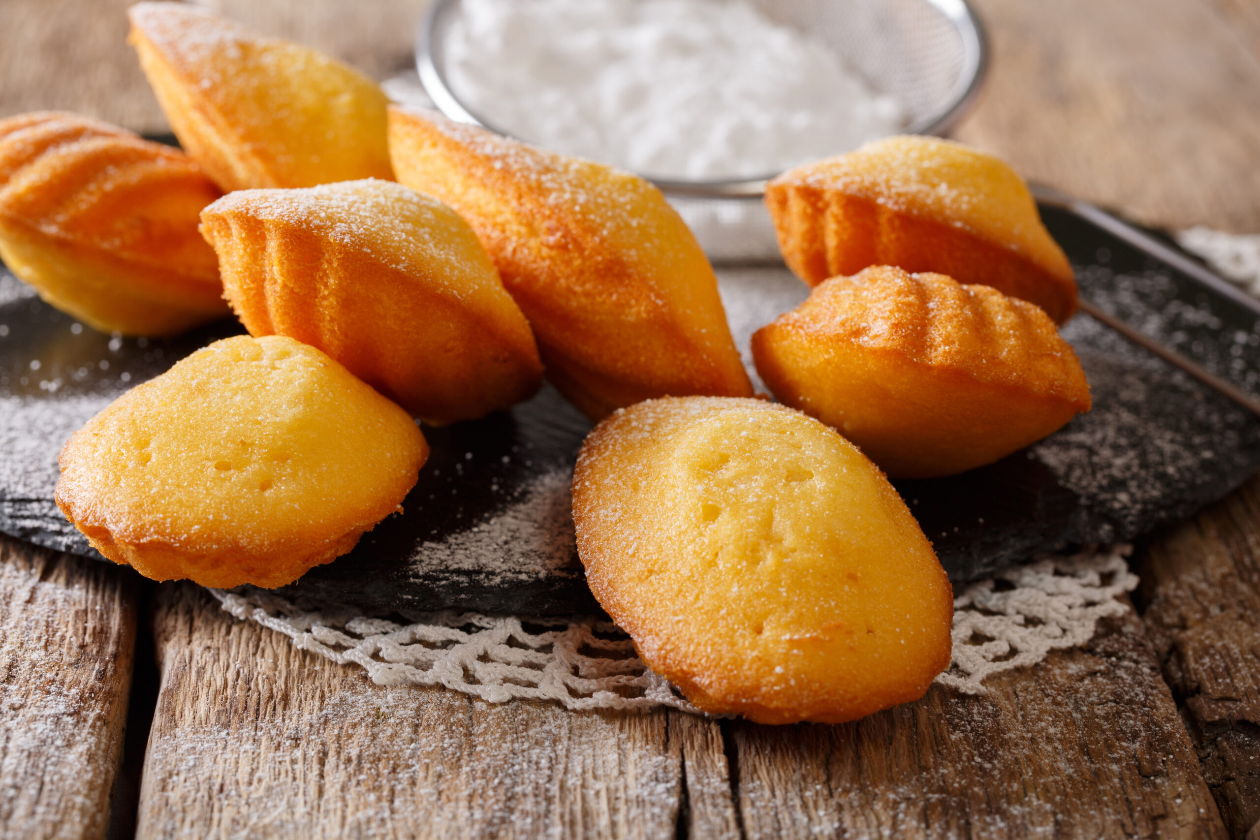 Homemade French biscuit Madeleine close-up on the table. Horizontal